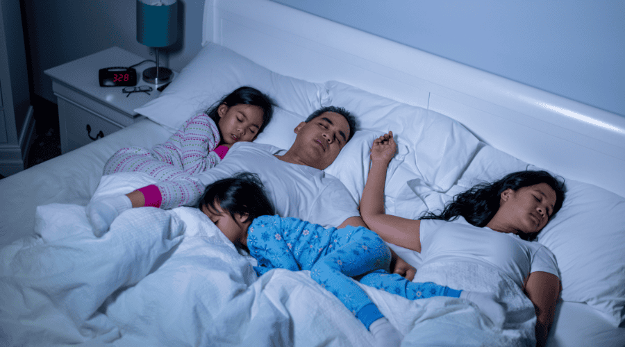 Family sleeping safely in corporate housing 